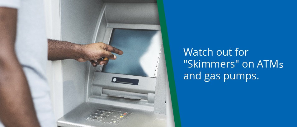 Watch out for "Skimmers" on ATMs and gas pumps - Man using an ATM.